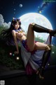 A woman in a sailor outfit is sitting on a wall in front of a full moon.