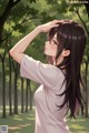 A girl with long black hair standing in a park.